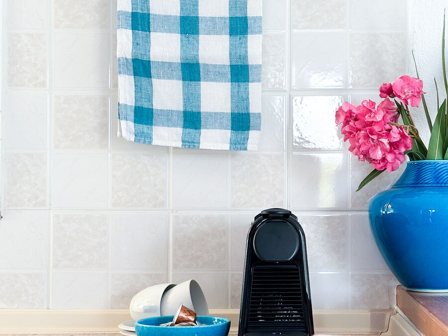 Bathroom with towel and fresh flowers