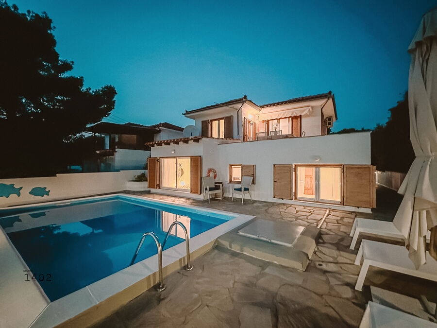 Villa and pool at dusk