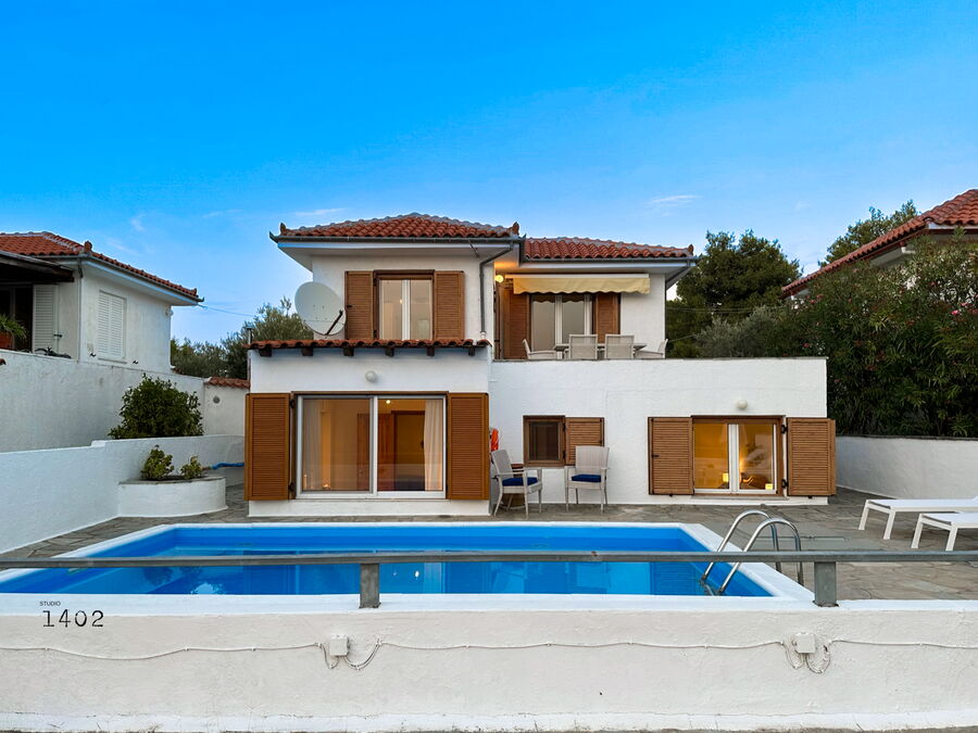 Villa with pool by day